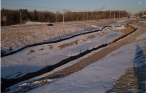This photo shows Erosion control blanket stabilizes pond slopes