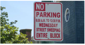 This image shows a no parking for street sweeping sign. Image Courtesy of Emmons & Olivier Resources, Inc.