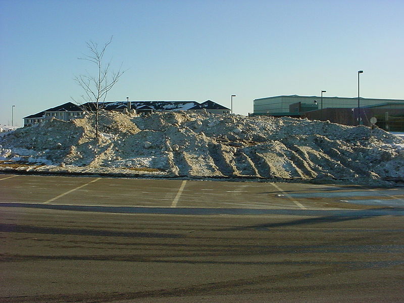 File:Plowed snow off parking lot to grass area.jpg