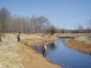 photo showing use of curved rather than straightened channels to reduce erosion