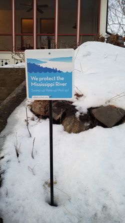 image of a yard sign for a stormwater drain adoption program