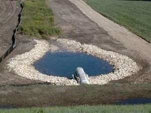 This picture shows an example riprap stilling basin plunge pool installation