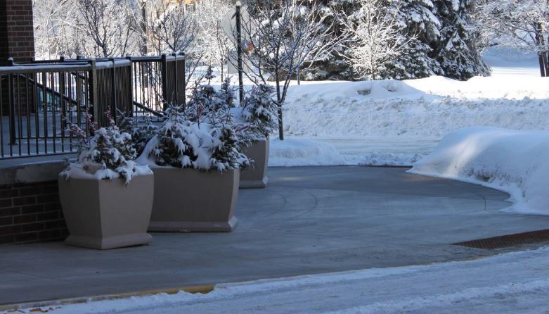 image of sidewalk cleared of ice through use of hydronic snowmelt tubing